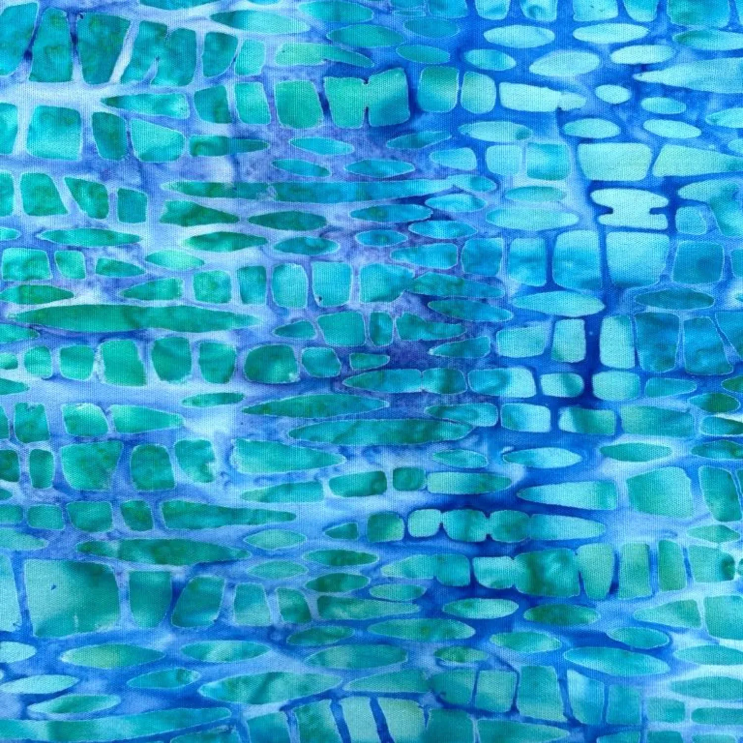 Tela batik algodón fondo turquesa formas azules